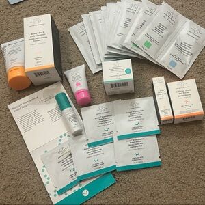 Drunk Elephant Skincare Collection with Orange, Pink, and Teal Accents